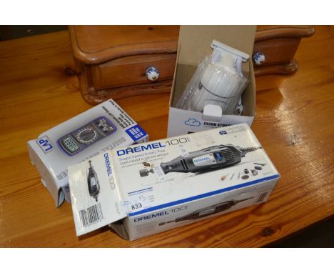 Dremel single speed rotary tool together with a digital multi meter and a security camera (3). NOTE: The dremel tool is 120 v