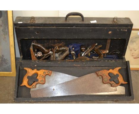 Vintage wooden tool box with a selection of woodworking tools