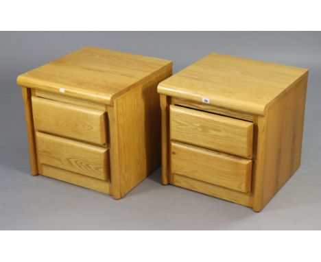 A pair of light oak-finish two-drawer bedside chests, 18¾” wide x 18¾” high.