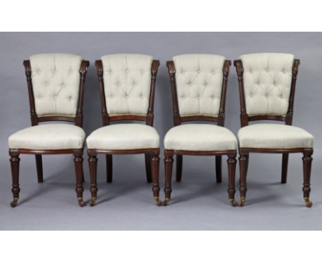 A set of four Victorian mahogany dining chairs, with padded backs &amp; seats upholstered light grey fabric, on turned &amp; 