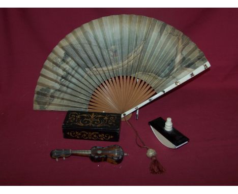 An Italian tortoise shell and mother of pearl model of a Guitar, an ivory desk blotter, Oriental fan and a small oblong box. 