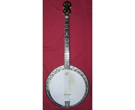 A Vegaphone Professional Tenor Banjo with mother of pearl inlaid fret board and maple back, overall length 33" (84cms), cased