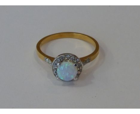 Another silver gilt opal set Dress Ring of circular design.