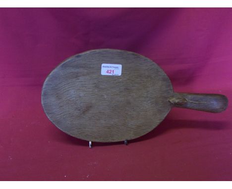 A Thompson of Kilburn 'Mouseman' oak oval Cheese Board with carved mouse signature to handle.  15" (38cms) length.