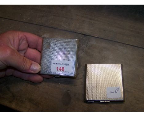 An engine turned silver Powder Compact and one other.