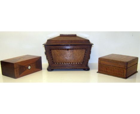 A Victorian walnut sarcophagus shape Tea Caddy, the interior fitted with two covered containers on compressed bun feet and tw