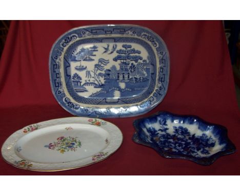 A 19th Century Earthenware Meat Plate printed with the willow pattern in blue and white, 16" (41cms) wide, a 19th Century Spo