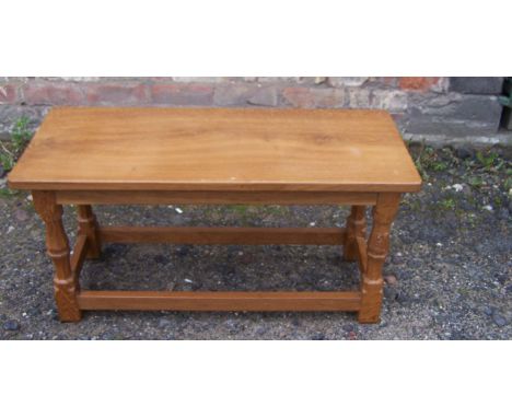 A Wilf "Squirrel Man" Hutchinson oak oblong Occasional Table on panel sided supports and with carved squirrel signature, 2' 9