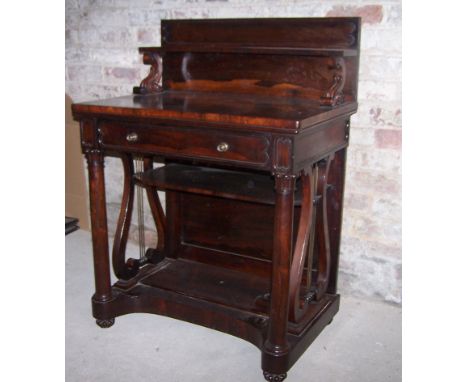 A late Georgian rosewood Chiffonier of Gillows design, the raised back fitted with an open shelf above a single frieze drawer