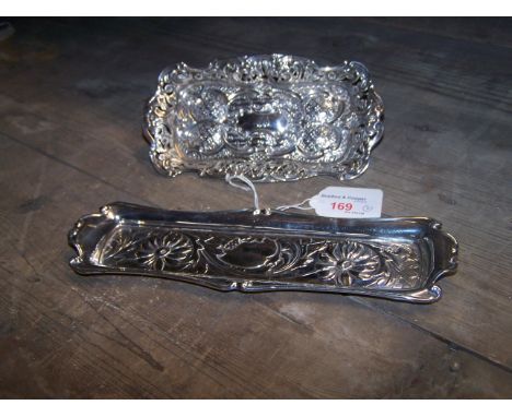 A silver oblong Dressing Table Tray embossed, chased and pierced with flower heads, scrolls, rosettes etc., Birmingham, 1910,