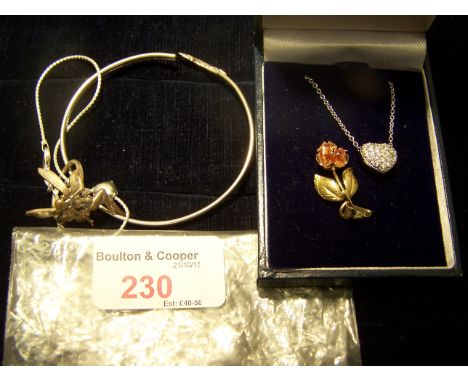 A silver Swarovski Pendant, a 9ct. gold two tone rose pendant, silver bangle etc.