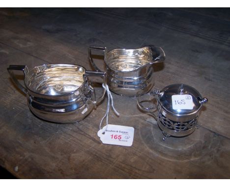 A silver Sugar Bowl and Cream Jug, Sheffield, 1916 and a silver mustard pot, Chester, 1915.  (7ozs).