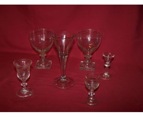 Another Cordial Glass with funnel shape bowl, plain stem and circular foot, a miniature 19th Century glass with trumpet shape