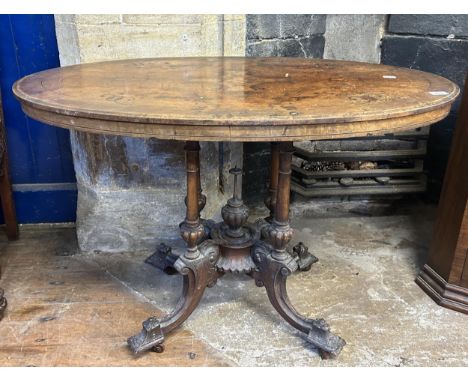 A 19th century walnut oval table, 106 cm wide