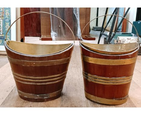 A near pair of 19th century mahogany and brass bound buckets, with ring handles, 41 cm wide (2)