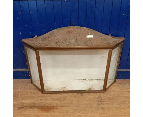 An unusual copper wall hanging display cabinet, with a glazed front, flanked by two cupboard doors, 81 x 132 cm