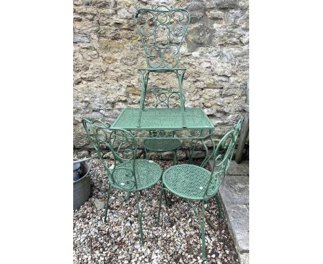 A painted metal table and four painted metal chairs (5)