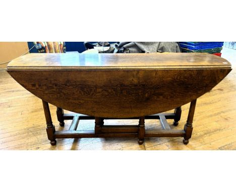 An 18th century style oak gateleg wake type table, stamped Titchmarsh &amp; Goodwin, 170 cm wide