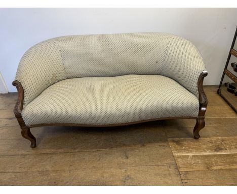 An early 20th century mahogany two seater sofa, with a carved frame, 150 cm wide