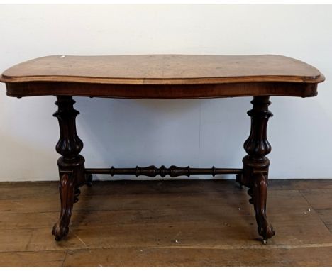 A 19th century walnut serpentine sided table, 122 cm wide