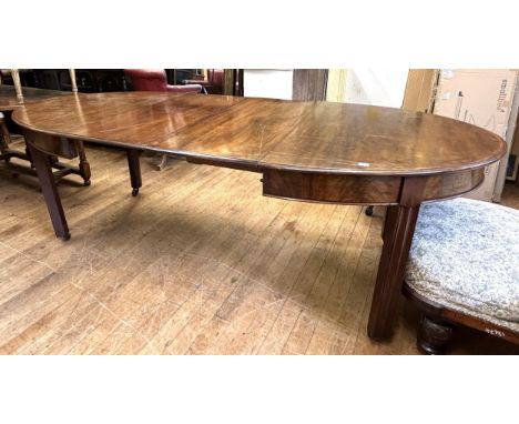 A 19th century mahogany oval extending dining table, the top 155 x 110 cm, with two 46 cm leaves