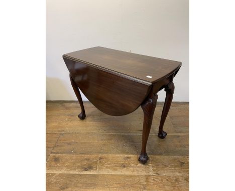 A mahogany drop leaf table, on carved cabriole legs to claw and ball feet, 85 cm wide