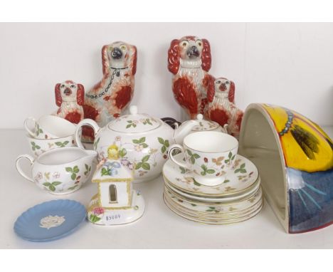 A pair of Staffordshire flatback spaniels, a Poole lamp, a part tea service, a Dresden figure, a mirror, a print, assorted ot