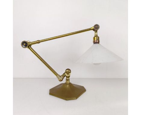 An early 19th century brass adjustable table lamp, on a squared base