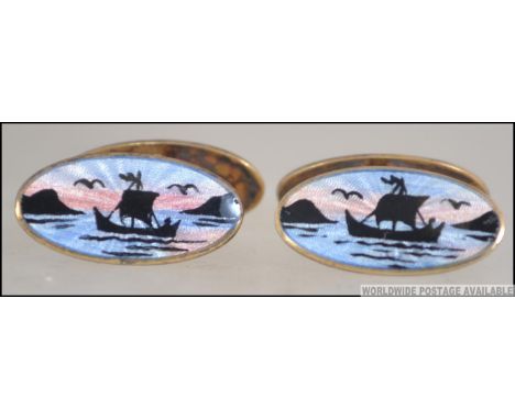 A pair of David Andersen Scandinavian silver 925 enamel cufflinks with scene of deer and viking ships with Northern Lights ba