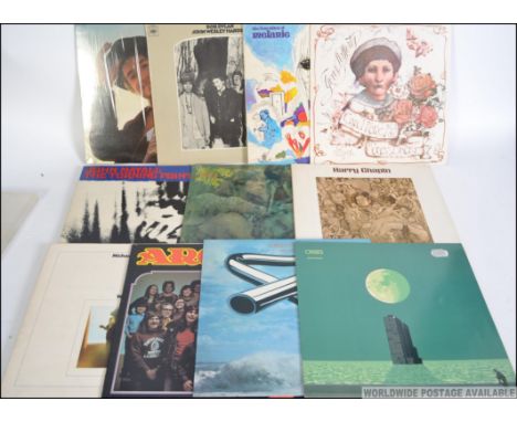 A collection of vintage vinyl long play records mainly relating to folk to include Bob Dylan x 2, Melanie, Gerry Rafferty, Mi