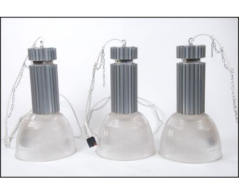 A set of contemporary factory pendant lights by Profile Lighting ( large ) model no HBX/HTCD/3CR4ZE1 , each with clear plasti