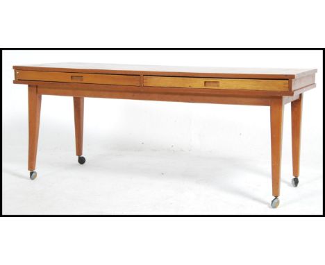 A 1970's retro vintage teak wood coffee table - nest of tables. The rectangular table with 2 faux drawers that pull out to re