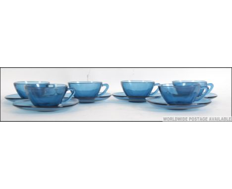 A stunning 1970's retro French made pressed blue glass coffee / set. Consisting of six cups and six saucers.