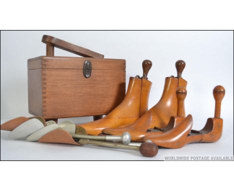 A vintage mid 20th century shoe shine box with some contents along with wooden and metal shoe / boot stretchers. The box meas