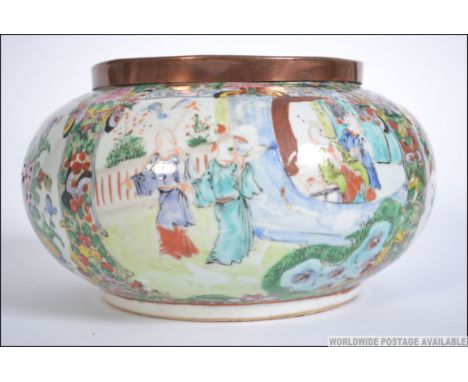 A 19th century Chinese famille rose ceramic bowl. With painted panel of family scenes along with panel of fauna and bird scen