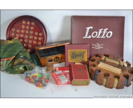 A collection of games to include an early wooden poker chip set with 2 packs of Bristol playing cards, Lexicon, Solitaire, So