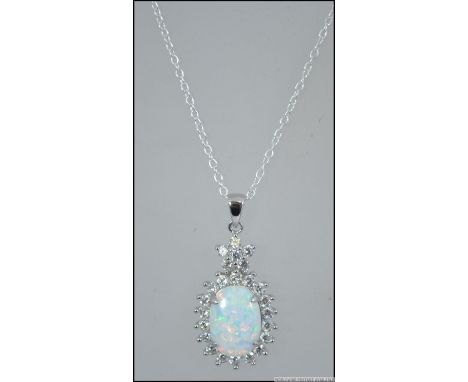 A contemporary silver opal and cz stone pendant necklace set to a fine linked silver chain. Size 44cms / Weight 6g