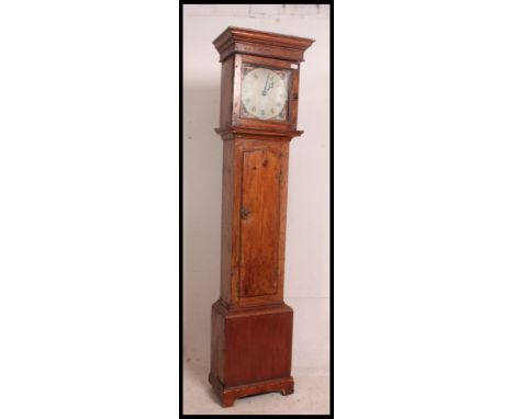 A 19th century country oak painted face longcase clock. The oak hood and trunk with painted face and movement having illegibl