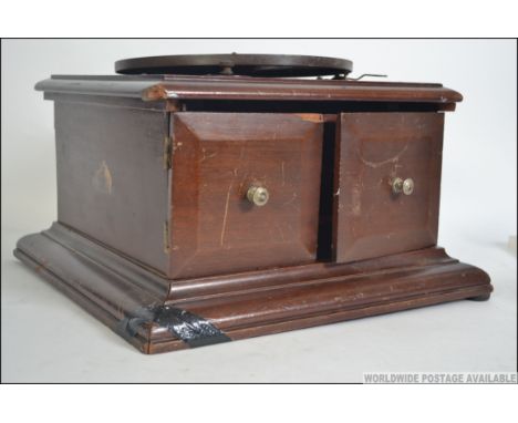 A vintage early 20th century mahogany cased table top side winding gramophone