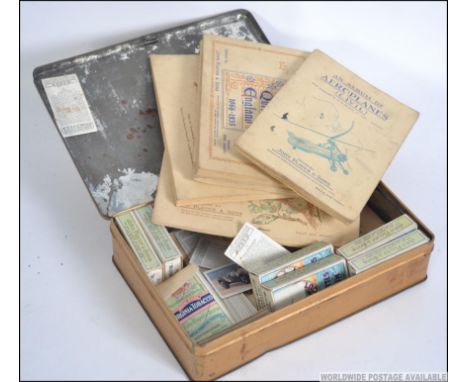 A collection of vintage cigarette cards. Mainly Players some in books some loose and sets in cigarette boxes