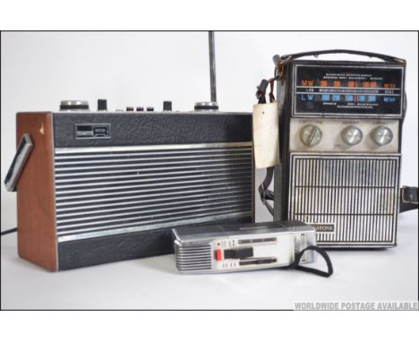 A vintage teak cased Roberts portable radio, a Monotone transistor radio along with a vintage Grundig Dictaphone