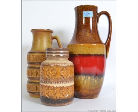 A set of three 1970's retro  West German fat lava decorative ceramic pots / vases of varying form. Please see images.