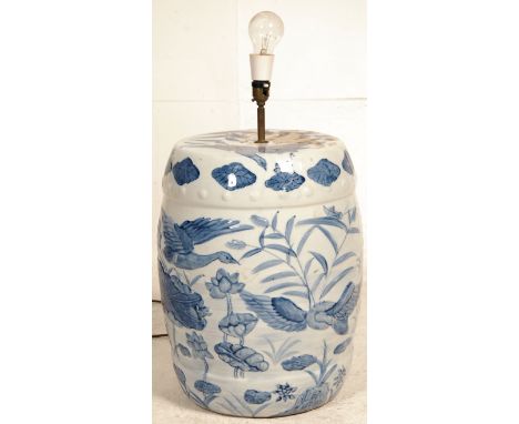 A large 20th century Chinese blue and white ceramic table lamp of oversized form. The white glaze with blue decoration in the