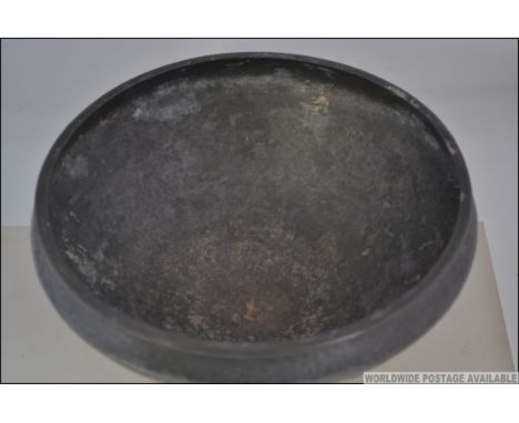 A circa 1907 believed Oliver Baker for Liberty's Tudric pewter bowl on three feet with cornelian cabouchons around the rim. S