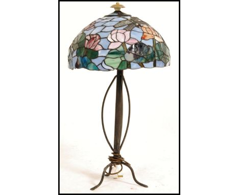 A 20th century Tiffany style multicoloured glass shaded lamp, on a metal base.  Measures: 78cms high x 42cms diameter. 