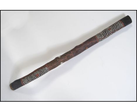 A traditional mid 20th century Aboriginal / Australian didgeridoo with painted animal and geometric decoration