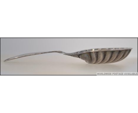 A Victorian silver hallmarked caddy spoon with oyster bowl and short stem handle by Henry Wilkinson having Sheffield hallmark