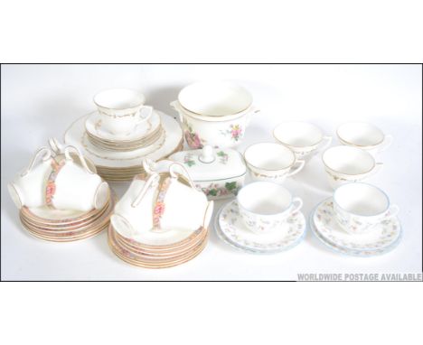 A Royal Worcester part dinner / tea service ' Forget Me Not ' to include trio's, plates of various sizes etc, along with a pa