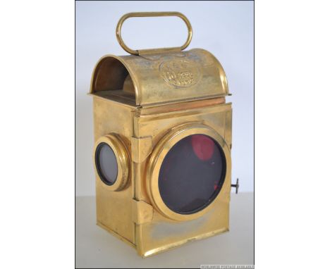 A mid century ER Royal cipher brass carriage travelling lamp of rectangular form with inset sherwoods ceramic wick. The plaqu