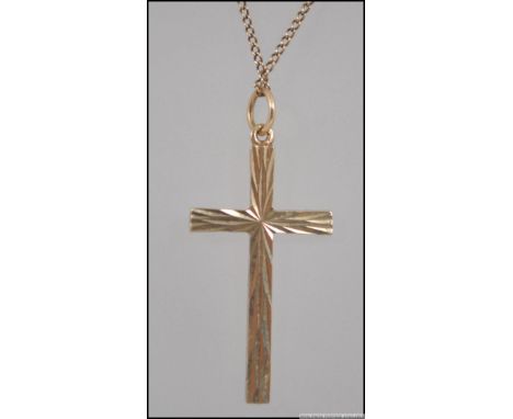 A 9ct gold engine turned cross - crucifix necklace pendant complete with chain and clasp , Weight approx 4.4g